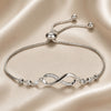 Sliding bracelet with white gold infinity symbol