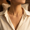 Necklace with spaced pearl chain in gold