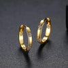 Vintage earrings in the shape of a circle with a golden flower