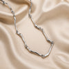 White Gold Necklace with Twisted Wave Design